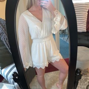 White long sleeve romper dress.